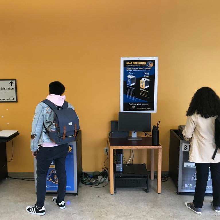 students printing on Wepa kiosks