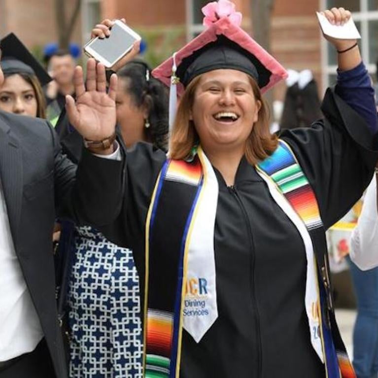 A family cheers on their graduate at the UCR RAZA Graduation ceremony in 2019