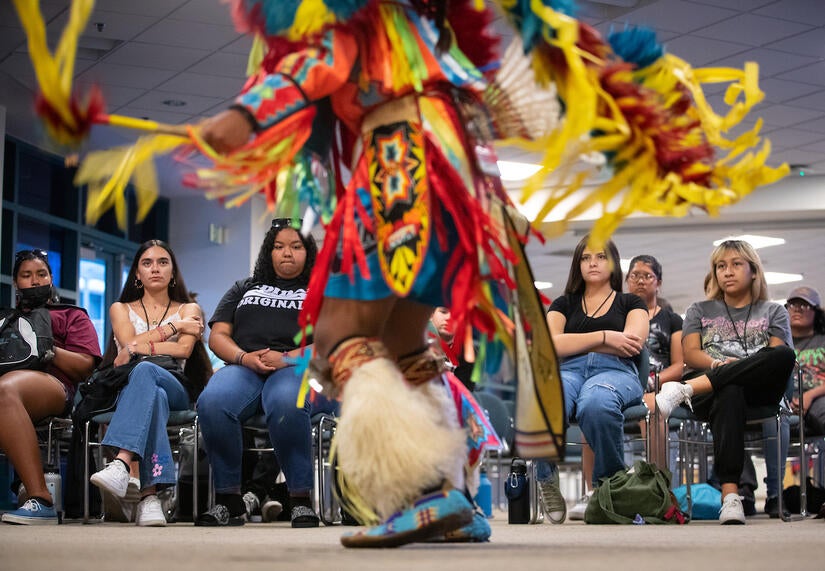 Gathering of the Tribes Summer Residential Program participants watch traditional dances during the day's culture night programming on Thursday, June 23, 2022 at UC Riverside.  (UCR/Stan Lim)