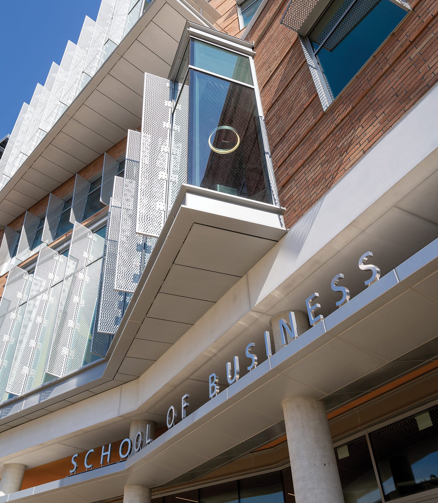 Exterior shot of the School of Business with focus on the UCR brick