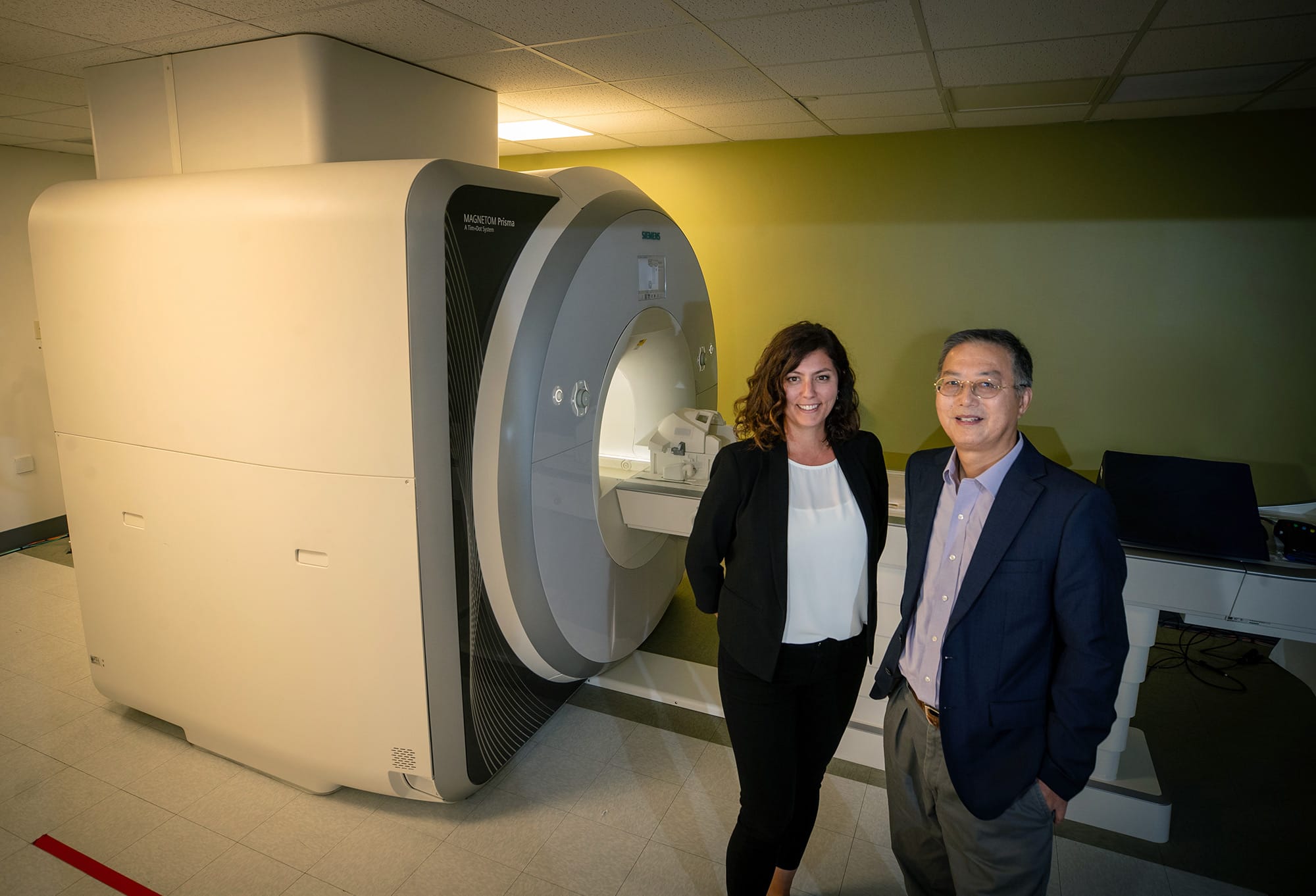 In their research into the links between inflammation and dementia, Ilana Bennett (left) and Xiaoping Hu use MRI scanners to examine regions of the brain for abnormalities.