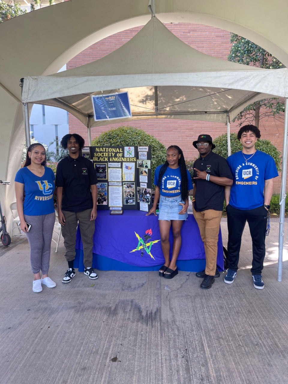 Black engineering students standing outside taking group photo