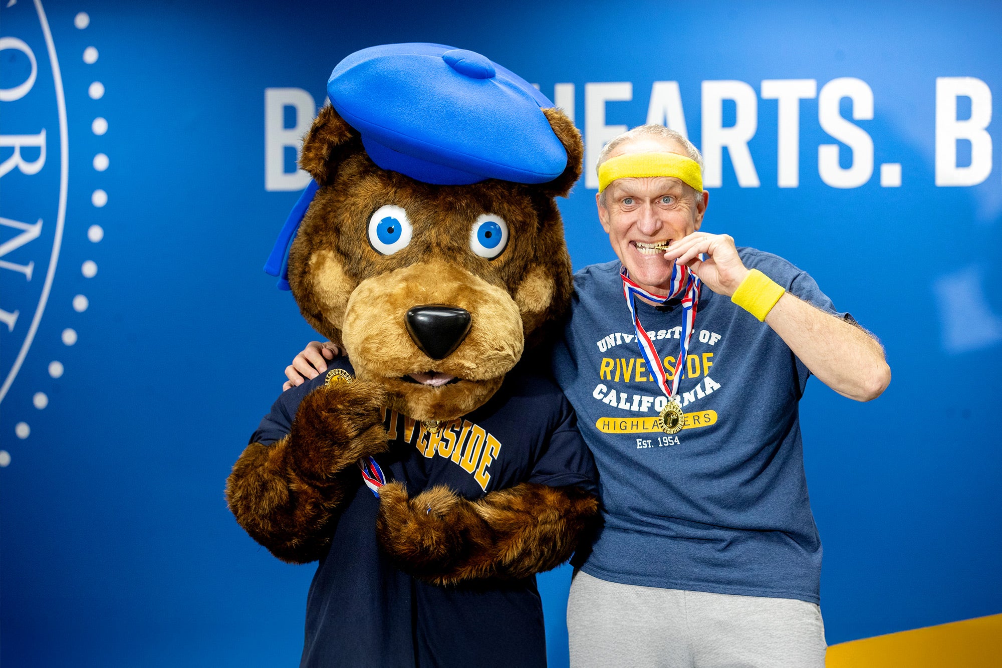 Wilcox poses with Scotty while filming an Olympics-themed welcome video for fall 2024. Wilcox poses with Scotty while filming an Olympics-themed welcome video for fall 2024.