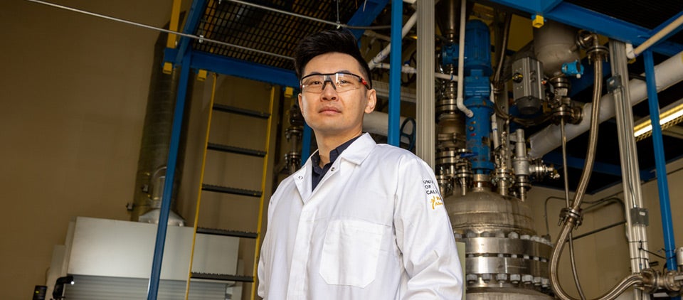 Charles Cai, UCR associate research professor and project leader, with a pilot-scale biomass processing unit.