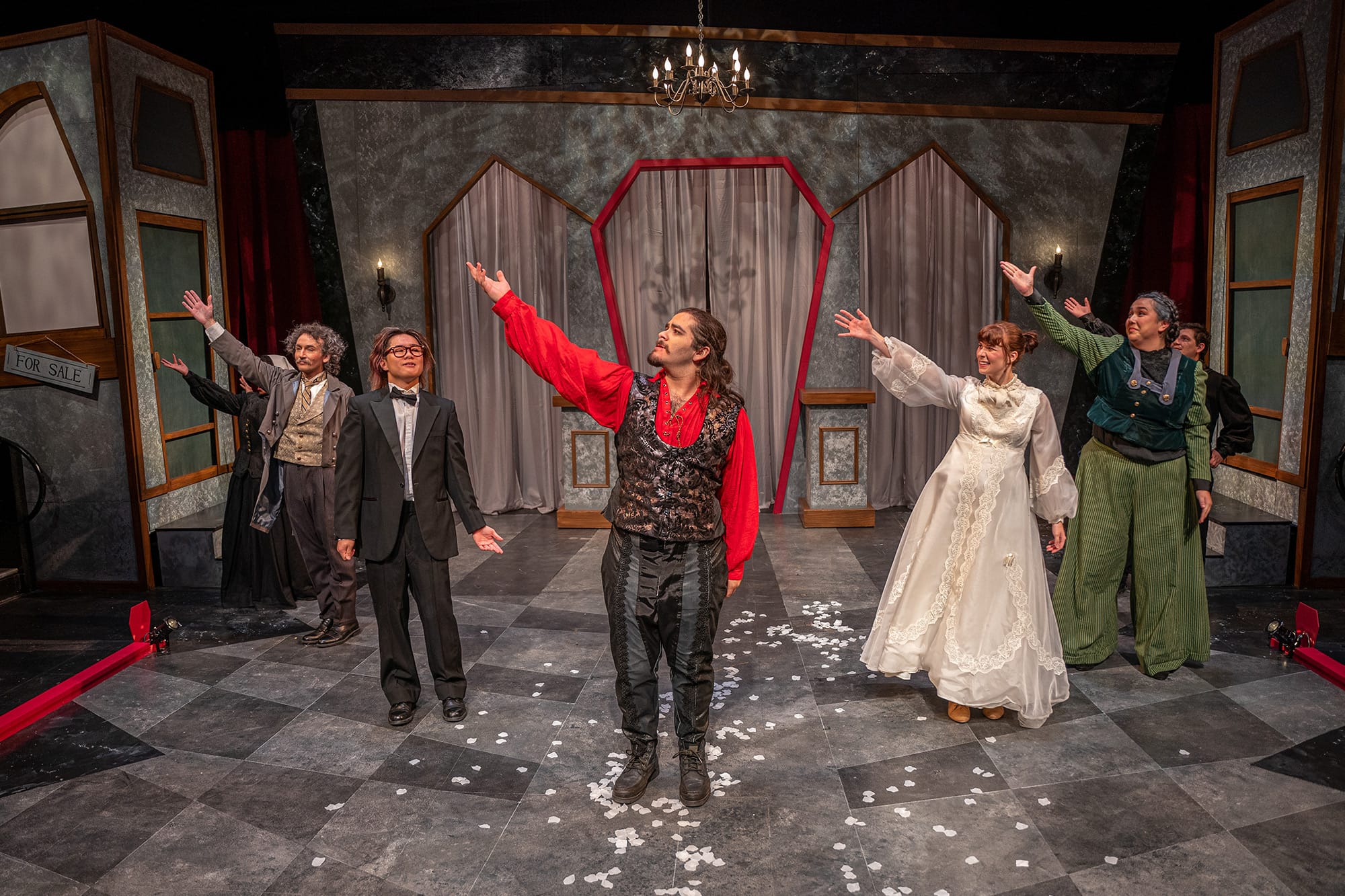 The cast gestures to the tech booth during their final bow to show gratitude towards the director, stage manager, designers, and production crew. (UCR/Denis Cha)