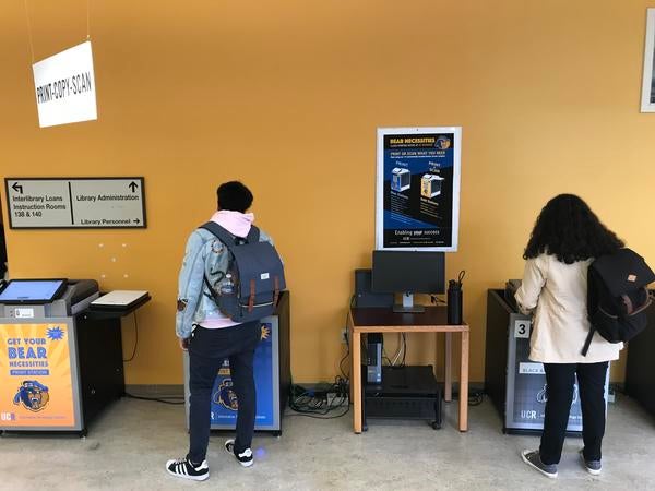 students printing on Wepa kiosks