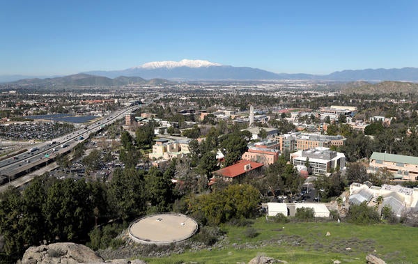 A view overlooking UC Riverside with snow-covered Mt. Baldy in the distance