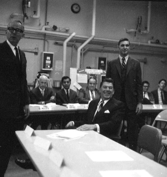 The presentation Reagan heard was in the windowless Fawcett Laboratory building. At left is UCR Chancellor Ivan Hinderaker. Then-and-current UCR professor Ron Loveridge is pictured second from right, seated behind the table.