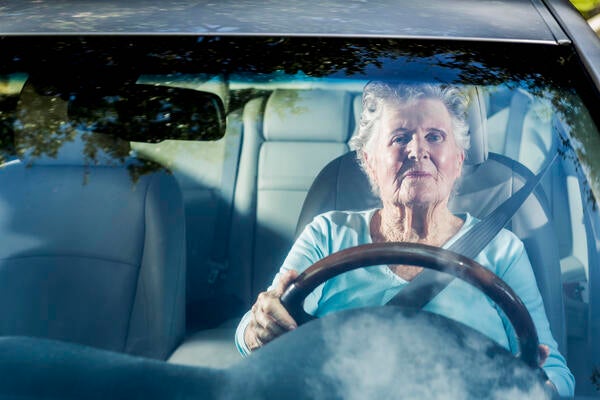 Senior citizen driving a car
