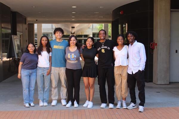 Black engineering students standing outside taking group photo