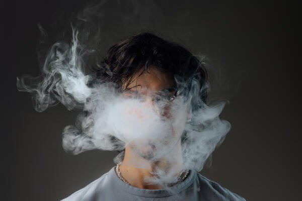 Man vapes