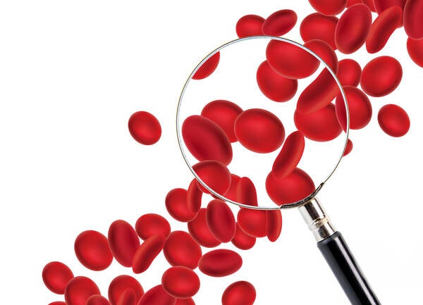 Red blood cells and a magnifying glass