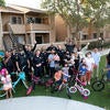 Members of the University of California Riverside Police Department and families at Oban Family Housing on Friday, September 17, 2021. Officers and staff from UCPD purchased an assortment of bikes for the children of UCR student parents who reside in this family housing community. (UCR/Stan Lim)