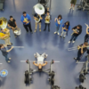 UCR Pep Band surrounds weight lifter at SRC South MAC Gym. (Malinn Loeung)