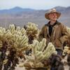 UCR researcher David Biggs stands among the chollas in Joshua Tree’s Cholla Cactus Garden.