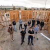Portrait of UC Riverside mechanical engineering undergrads at an energy-efficient home they designed and building on Wednesday, January 10 2024, in an empty lot next to the SRC. (UCR/Stan Lim)