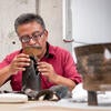 Ceramicist Guillermo Garcia Romān works with a ceramic piece collected from the archeological sites in Teotihuacan.