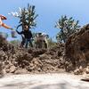 Community laborers remove soil from an excavation site in Teotihuacan.