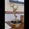 The Emmy award Lewis won in 2020 for helping produce a segment for KCET’s “Blue Sky Metropolis” series sits atop a bookshelf in his office.