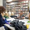 From left: Landis Maren York and students Heather Klippness and Isabella Hogan work on an assortment of costumes.