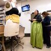 Cast member Avery Branley has a laugh with costume designer Landis Maren York as she has a last minute costume adjustment before their final dress rehearsal.