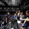 From left: Students Theo Ruiz, Ren Nguyen, Sonia Tinoco,  Alex Corral, and Naidelym Velasquez listen as Sara Schatmeier explains the stage lighting.