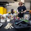 Student Daniella Escobar (left) and Kerry Jones discuss the best way to assemble a key floral prop.