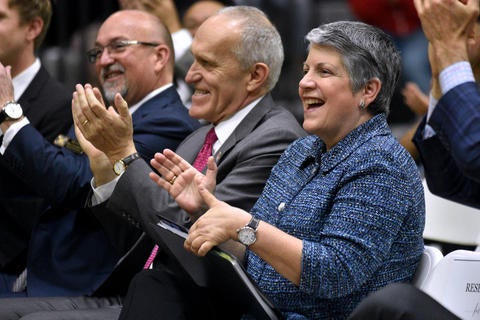 UC Riverside Chancellor Kim Wilcox and UC President Janet Napolitano applaud.