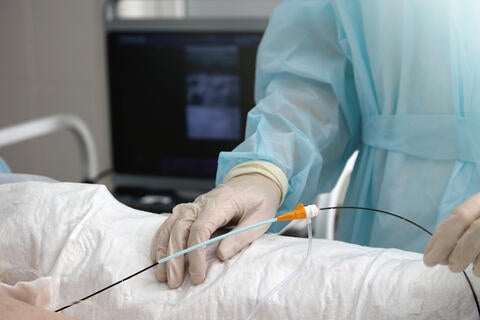 surgeon using catheter