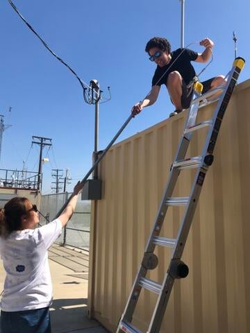 grad students installing monitors