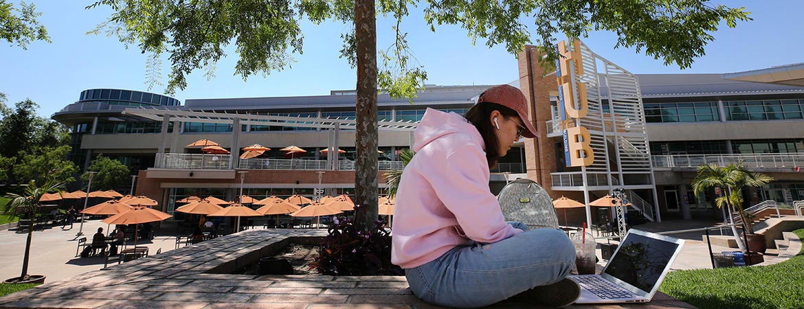 student studying on UCR campus