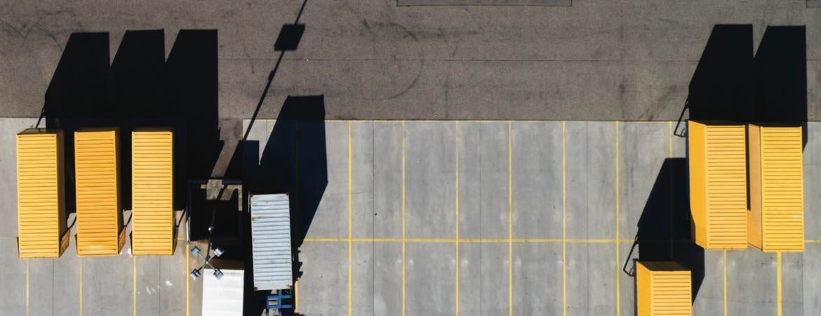 Trucks parked in front of a warehouse