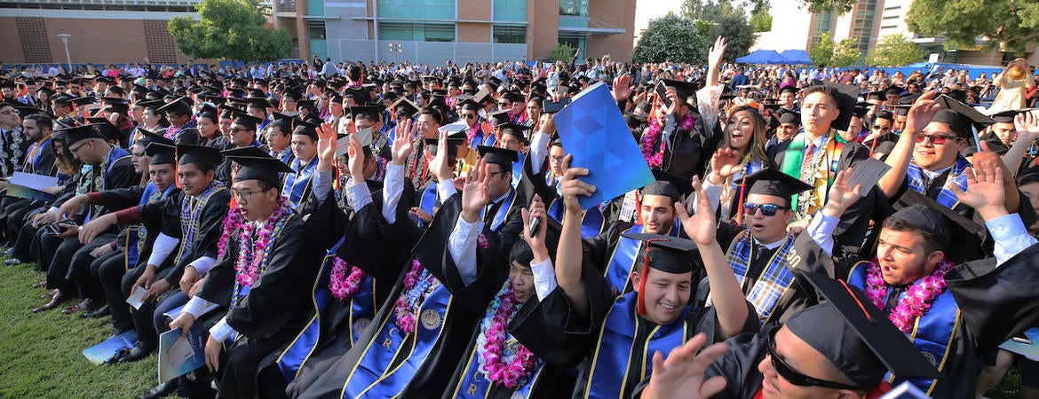 Graduates cheer at the UC Riverside commencement 