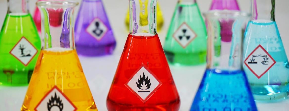 Bottles of chemicals with hazard labels