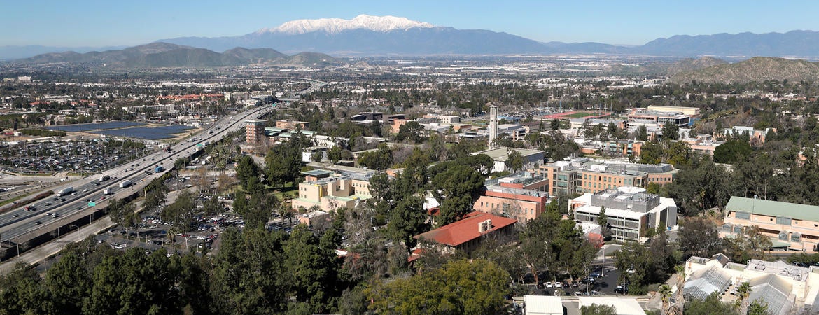 A view overlooking UC Riverside with snow-covered Mt. Baldy in the distance