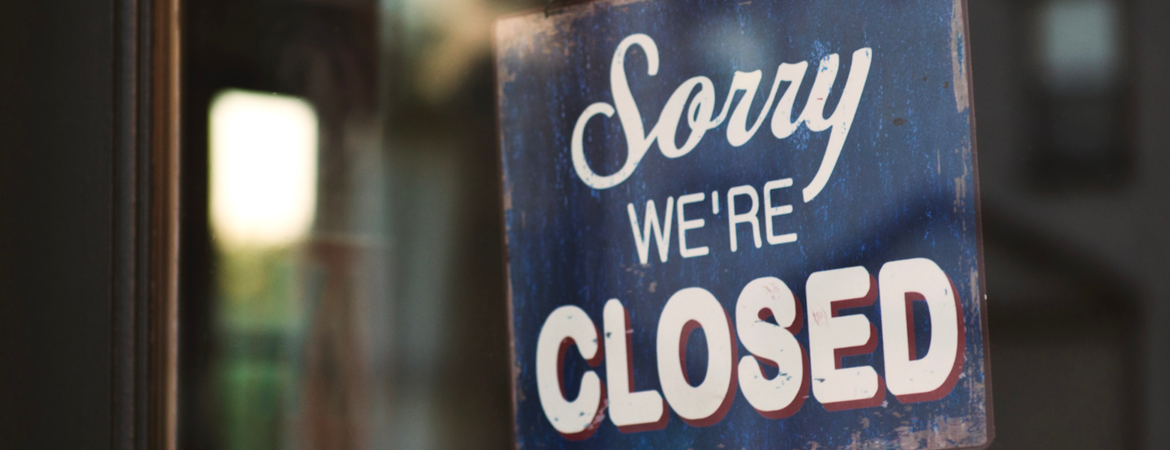 A shop with a closed sign.