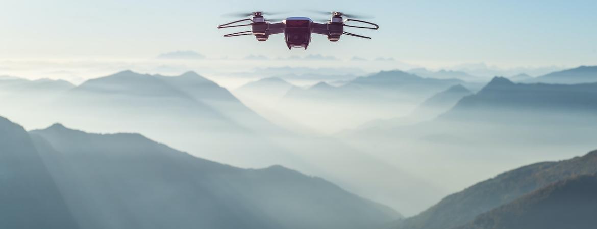 drone flying over mountains