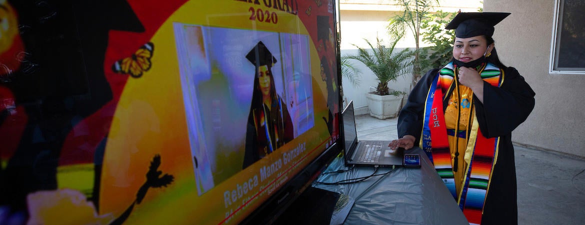 Jacqueline Hernandez Rico, 33, sets up for her family to watch the virtual Raza Grad ceremony on June 13, 2020 in Perris. (UCR/Stan Lim)