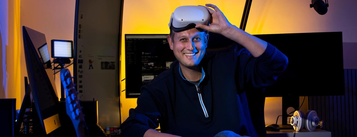 Assistant Professor Ilya Brookwell sits in the new MCS Livestreaming and VR Lab