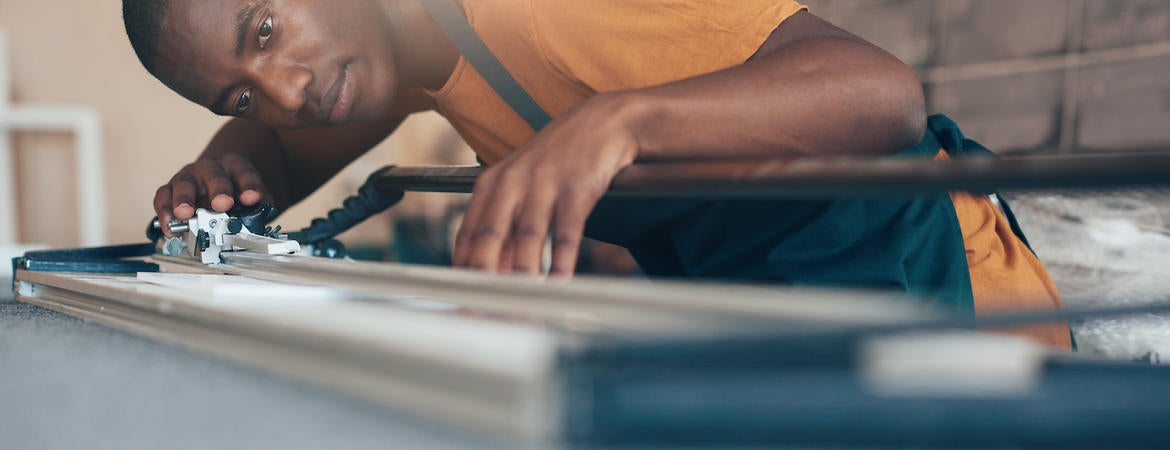 A worker calibrates an instrument or machine