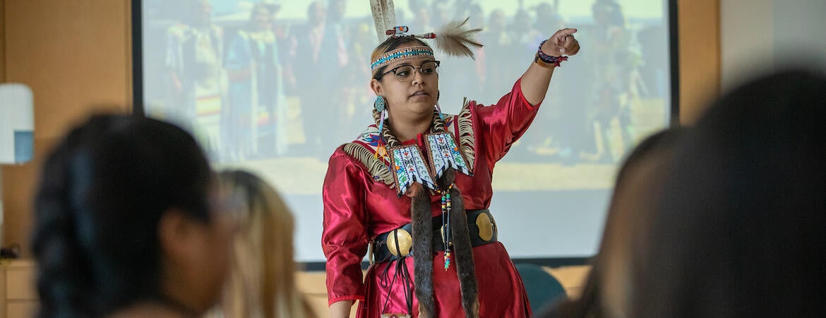 Katianna Warren, UCR's former Pow Wow Princess, answers questions for Native American youth during an activity in Bear Cave as part of Gathering of the Tribes Summer Residential Program on Thursday, June 27, 2022 at UC Riverside.  (UCR/Stan Lim)