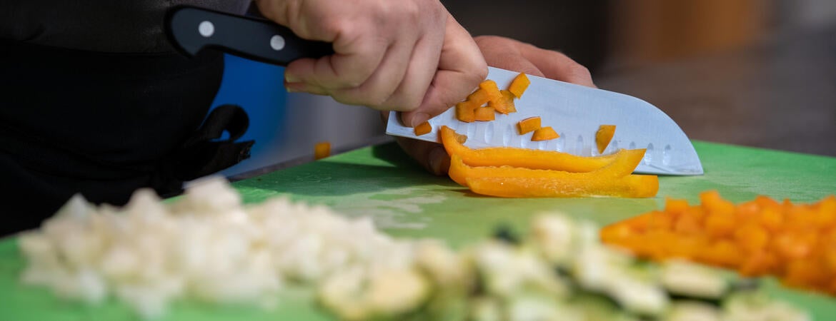 Chef Val cutting vegetables