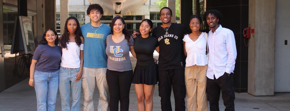 Black engineering students standing outside taking group photo