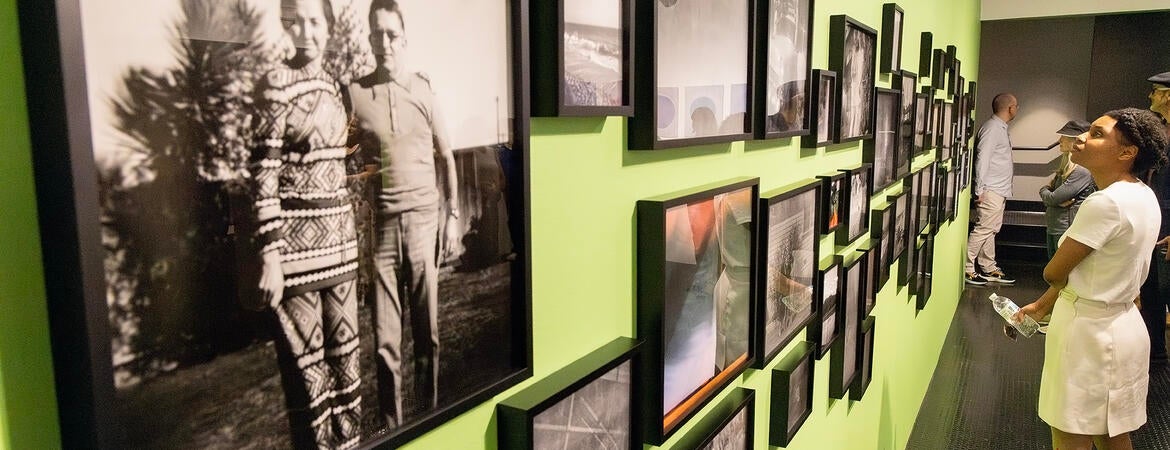 A woman views the "Shadow Archive" exhibition at UCR ARTS
