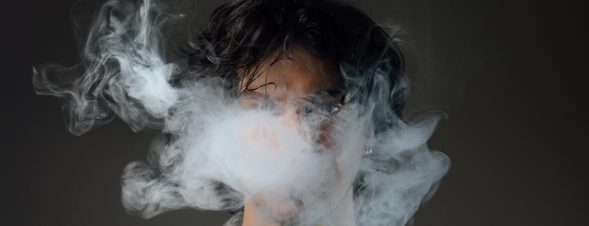 Man vapes