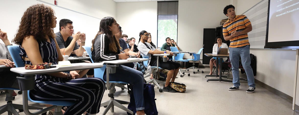 A student presents to a class at UC Riverside