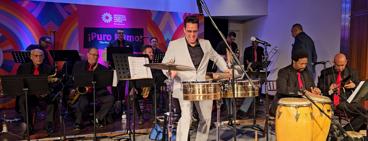 A man plays the timbales with the Mambo Legends Orchestra.