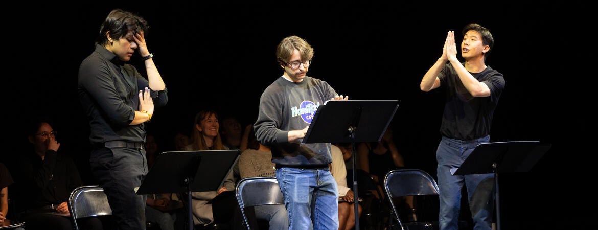 Students performing a stage reading