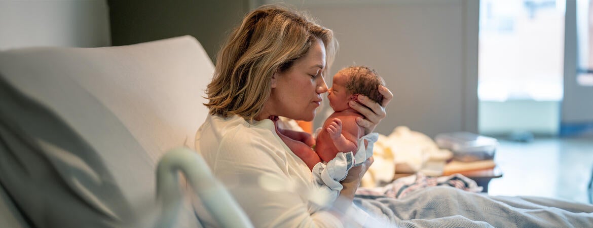 Mother with newborn baby in hospital