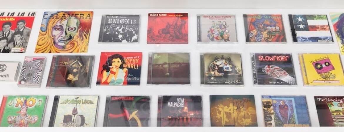 Photo of record jackets and CD cases.